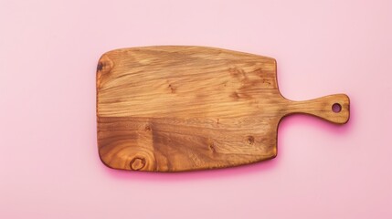 A wooden cutting board rests elegantly on a soft pink background