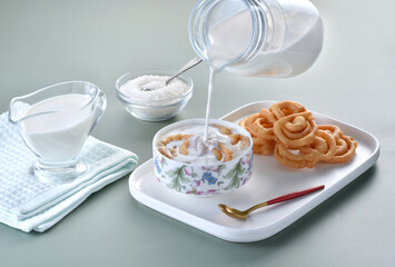 Jalebi with milk, unsweetened jalebi is used in Ramadan with warm milk and sugar. It is healthy and delicious meal.