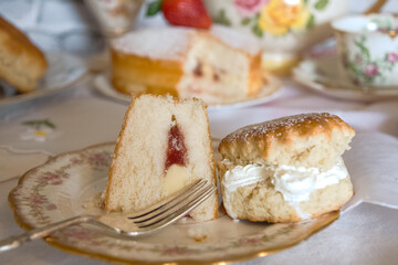 traditional afternoon  tea  vintage high tea  strawberries and  cream   traditional scones  Victoria  sponge  vintage  china