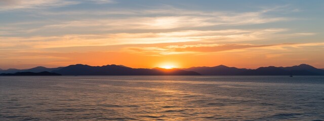 View of the sea and mountains with the evening sun