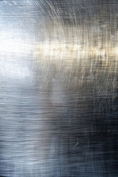 Vertical Texture background of brushed steel.