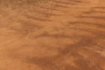 a walking red path made of rammed sand after sweeping