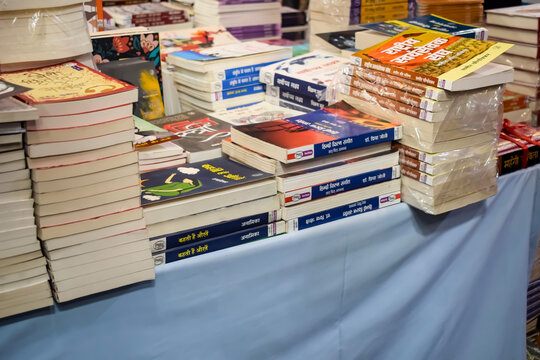 New Delhi, India, February 17 2024 - Variety of Books on shelf inside a book-stall at Delhi International Book Fair, Selection of books on display in Annual Book Fair at Bharat Mandapam complex
