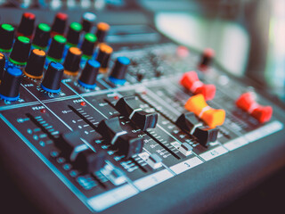 Close-up of sound recording equipment knobs.Mixer control. Music engineer. Backstage controls on an...