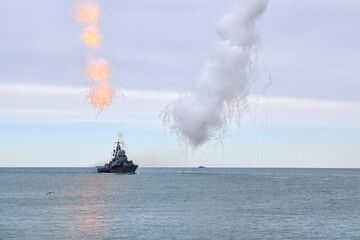 Russian warship fired decoy flares for self defense, sailing at sea military ship used anti missile protection throw heat seeking missiles off course, Russian sea power deployment demonstration © TRAVELARIUM