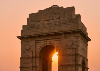 India Gate landmark at glorious sunset, war memorial in New Delhi near Kartavya path, All India War Memorial to indian army soldiers who died in First World War, landmark made from red sandstone - obrazy, fototapety, plakaty