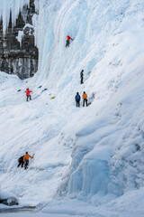 A group of unrecognizable people begin an ice climb at Johnston Canyon in Banff National Park,...