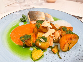 Delicious sea bass with potatoes and carrot mush