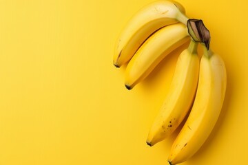 Bright yellow background with bunch of bananas