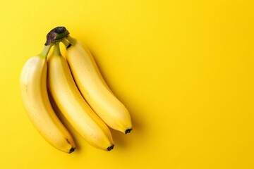 Bright yellow background with bunch of bananas
