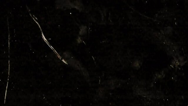 The film effect is superimposed on a frame on a black background