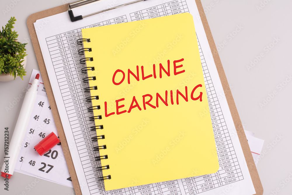 Poster yellow notebook with 'online learning' text on a grey background signifies a focus on education, ski
