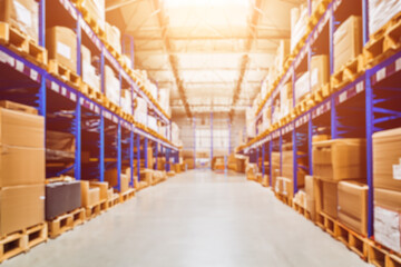 A storehouse interior with a background blur. The image captures a modern and large warehouse with...