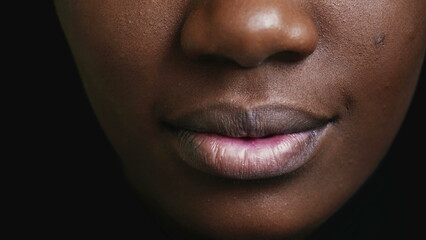 One Happy Adult black girl mouth macro closeup detail smiling, 20 woman teeth and lips of African...