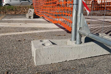 concrete pedestal for high visibility net, work in progress on a construction site, support for...