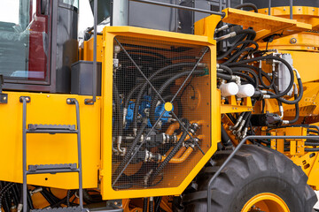 Close-ups of some large construction machinery and equipment