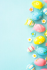 Easter eggs on blue background. Flat lay with copy space.