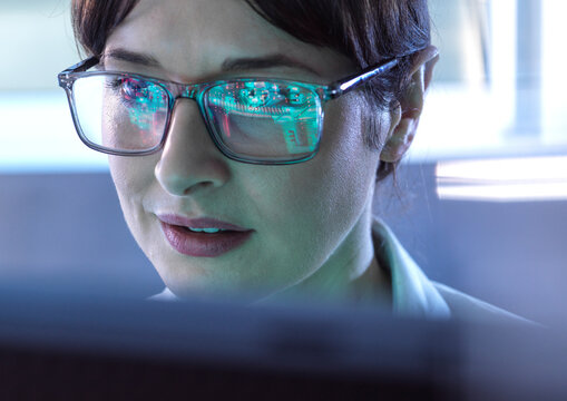 AI Engineering, Female STEM engineer using artificial intelligence to design micro electronics in the lab.