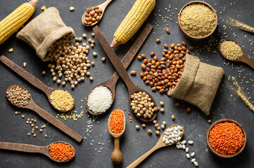 Different type of raw dry legumes composition. White beans, lentils, bulgur, chickpeas, kidney...