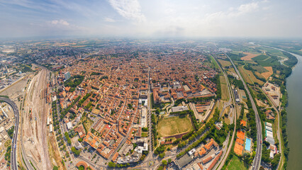 Piacenza, Italy. Piacenza is a city in the Italian region of Emilia-Romagna, the administrative center of the province of the same name. Summer day. Aerial view - obrazy, fototapety, plakaty