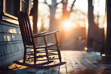 Fototapeten Verandazeit: Idyllisch-romantisches Bild eines Schaukelstuhls auf der Veranda © Seegraphie