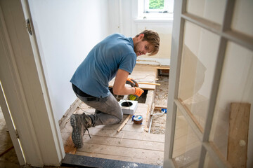 Man intently working on home renovation project