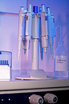 Laboratory bits and pieces bathed in blue light