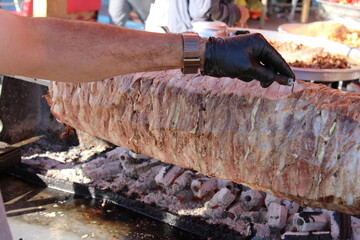 traditional turkish oltu cag crochet shish kebab doner grilled in wood fired oven. Famous yatik...