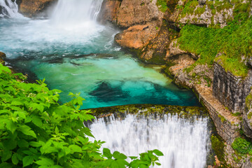 Savica waterfall with the clear turquoise water of the Velika Savica river in the heart of the...