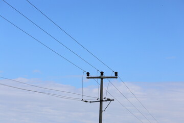 power lines on a clear sky