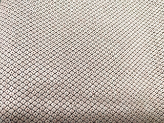 Close-Up View of a Textured Fabric Surface. Detailed texture of woven material with a geometric...