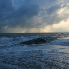 big stones in the sea in the morning with lots of waves