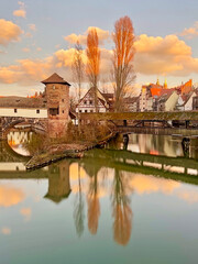 Colorful Symmetrical Reflection Nurnberg Cityscape, Germany, In Spring On Blue Orange Cloudy Sunset...