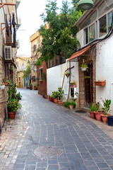 Fototapeta na wymiar Picturesque narrow street in the old town of Sur. Republic of Lebanon