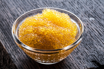 Pike caviar or roe in the bowl on wooden background. - 757258439