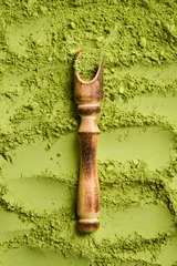 Fotobehang Matcha powder. Wooden spoon with matcha tea powder. Top view. Free space for text. © Yaruniv-Studio