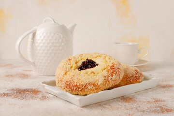 Homemade vatrushki, Russian round pastry with cottage cheese and sour cherry jam.