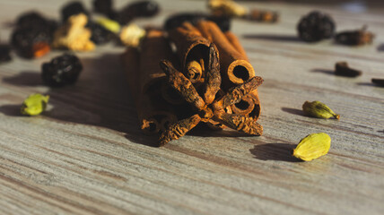 Cinnamon and star anise on wooden background