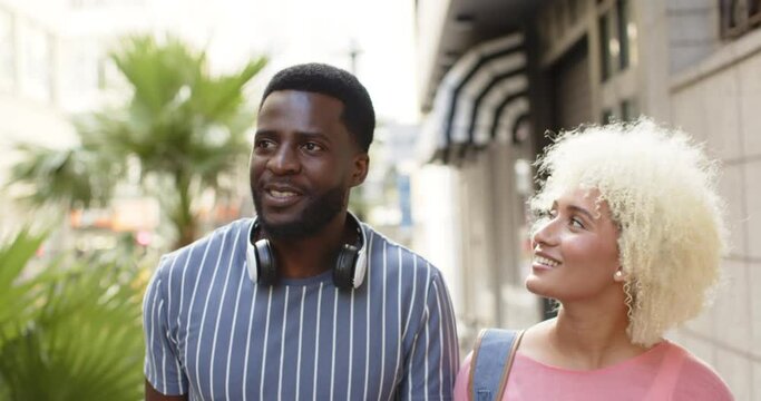 Vacation montage of African American man and biracial woman on a city break