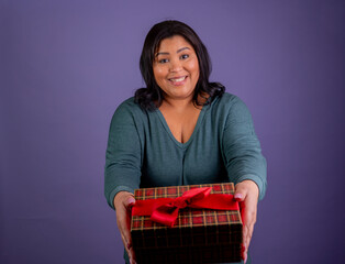 Hispanic Woman presenting a Christmas gift