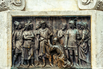 Metal engraved history scene in the monument to Calderon de la Barca (1880), Madrid, Spain