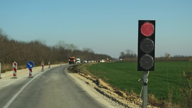 Red stoplight, traffic light signalization for regulation during road maintenance