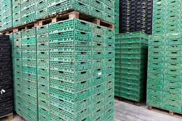 wall of colorful fruit crates ready to be filled