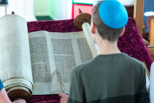 A Jewish boy practises reading the torah ahead of his coming-of-age bar mitzvah.
