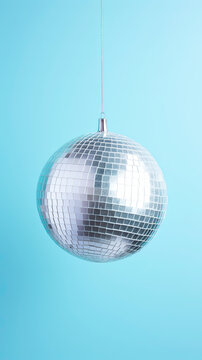 Glistering Silver Disco Ball. on blue pastel background
