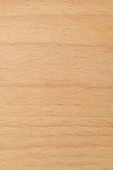 close-up of beechwood surface, pale cream color fine, even grain and smooth texture background or backdrop, furniture, flooring or decorative veneers, vertical orientation with copy space