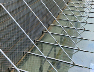 pond sluice, water reservoirs with regulation and concrete dam shaft. guide profiles determining...