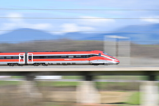 Frecciarossa high speed train running on the tracks in Italy