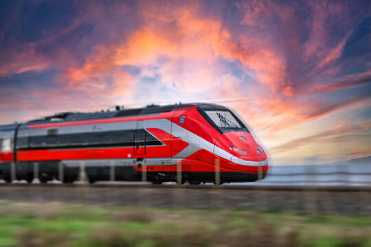 treno alta velocit&agrave; Frecciarossa high speed train running on the tracks in Italy