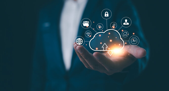 A futuristic representation of a business professional showcasing a network of icons symbolizing cloud computing and data security, glowing hand, innovative technology management. - Powered by Adobe